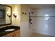 Bathroom featuring vanity with black granite top, vessel sink, dark fixtures, and a tiled walk-in shower at 5009 Old Bridgeview Ln # 5009, Charleston, SC 29403