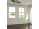 Bedroom with hardwood floors, large windows providing natural light and white trim at 5009 Old Bridgeview Ln # 5009, Charleston, SC 29403