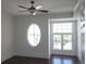 Bedroom with dark hardwood floors, crown molding, an oval window, and a window with grid panes at 5009 Old Bridgeview Ln # 5009, Charleston, SC 29403