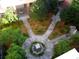 Aerial view of courtyard featuring a fountain, walkways, trees, and surrounding benches at 5009 Old Bridgeview Ln # 5009, Charleston, SC 29403