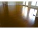 Close-up of lustrous hardwood flooring with natural light reflecting throughout the home at 5009 Old Bridgeview Ln # 5009, Charleston, SC 29403