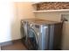 LG silver front load washer and dryer in laundry room with tiled floor at 5009 Old Bridgeview Ln # 5009, Charleston, SC 29403