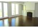 Living room with hardwood flooring, fireplace, and access to a balcony at 5009 Old Bridgeview Ln # 5009, Charleston, SC 29403