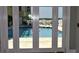View of pool through the set of french doors at 5009 Old Bridgeview Ln # 5009, Charleston, SC 29403