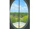 View of trees and sky from an oval window at 5009 Old Bridgeview Ln # 5009, Charleston, SC 29403