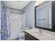Bathroom with bathtub/shower, modern vanity, and ample lighting at 507 Tayrn Dr, Charleston, SC 29492