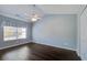 Bright bedroom with hardwood floors, a ceiling fan, and a large window at 507 Tayrn Dr, Charleston, SC 29492