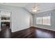 Inviting bedroom with a ceiling fan, hardwood floors, and a view to the kitchen at 507 Tayrn Dr, Charleston, SC 29492