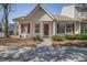 Charming home featuring red shutters, a well-manicured yard, and a welcoming front entrance at 507 Tayrn Dr, Charleston, SC 29492