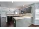 Well-lit kitchen featuring modern appliances, spacious countertops, and dark cabinets at 507 Tayrn Dr, Charleston, SC 29492