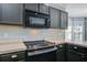 Close-up of stainless steel oven and microwave appliances inside a well equipped modern kitchen at 507 Tayrn Dr, Charleston, SC 29492