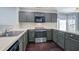 Functional kitchen with stainless steel oven and microwave, complete with cabinetry and countertops at 507 Tayrn Dr, Charleston, SC 29492