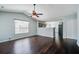 Open-concept living room features hardwood floors and a ceiling fan, offering a welcoming atmosphere at 507 Tayrn Dr, Charleston, SC 29492