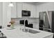 Close up of a kitchen with sleek white cabinets and stainless appliances at 5108 Celtic Dr, North Charleston, SC 29405