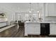 Open-concept kitchen and living space with an eat-in island and stainless appliances at 5108 Celtic Dr, North Charleston, SC 29405