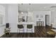 Open-concept kitchen and living space with an eat-in island and stainless appliances at 5108 Celtic Dr, North Charleston, SC 29405