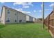 Large backyard featuring lush green grass and wood fence at 529 Pleasant Side Dr, Moncks Corner, SC 29461