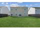 Home's backyard features a spacious green lawn and wood privacy fence at 529 Pleasant Side Dr, Moncks Corner, SC 29461