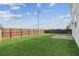 Large backyard featuring lush green grass and wood fence at 529 Pleasant Side Dr, Moncks Corner, SC 29461