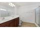 Bathroom featuring double sink vanity, glass enclosed shower, and neutral color palette at 529 Pleasant Side Dr, Moncks Corner, SC 29461