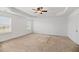 Bright bedroom featuring neutral carpet, two windows providing great light, and ceiling fan at 529 Pleasant Side Dr, Moncks Corner, SC 29461