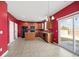 Eat-in kitchen featuring oak cabinets, black appliances, tile flooring, and access to backyard at 529 Pleasant Side Dr, Moncks Corner, SC 29461