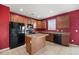 Eat-in kitchen featuring oak cabinets, black appliances, tile flooring, and lots of light at 529 Pleasant Side Dr, Moncks Corner, SC 29461