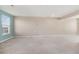 Large living room with neutral paint, carpet, and a window for natural light at 529 Pleasant Side Dr, Moncks Corner, SC 29461