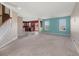 Open living room featuring bright colors, an adjacent kitchen, and a staircase to the second floor at 529 Pleasant Side Dr, Moncks Corner, SC 29461