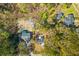 Aerial view of residences in wooded area highlighting property lines and surrounding landscaping at 671 Riley Rd, Charleston, SC 29412