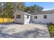 Backyard with a concrete patio, wooden fence, and white exterior at 671 Riley Rd, Charleston, SC 29412