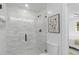 Gorgeous bathroom with glass enclosed shower and grey tiled walls at 671 Riley Rd, Charleston, SC 29412