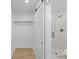 Bathroom features a glass enclosed shower with grey tiled walls and a white sliding barn door at 671 Riley Rd, Charleston, SC 29412