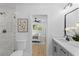 Ensuite bathroom with glass shower, double sink vanity and view to the bedroom at 671 Riley Rd, Charleston, SC 29412