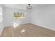 Bright, spacious bedroom with wood floors, shiplap wall and recessed lighting at 671 Riley Rd, Charleston, SC 29412