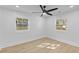 Bright bedroom with modern fan, recessed lighting, and two windows offering natural light and exterior views at 671 Riley Rd, Charleston, SC 29412