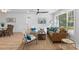 Inviting living room featuring a cozy brown leather sofa, stylish seating, and ample natural light at 671 Riley Rd, Charleston, SC 29412