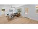 Bright and airy living room featuring stylish decor, wood floors, and plenty of natural light at 671 Riley Rd, Charleston, SC 29412