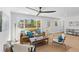 Inviting living room bathed in natural light, featuring comfortable seating and stylish decor at 671 Riley Rd, Charleston, SC 29412