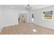 Spacious living area with light wood floors, recessed lighting and neutral paint colors at 671 Riley Rd, Charleston, SC 29412
