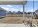View of backyard showcasing a wooden swing and playset with a wood fence line at 69 Arrowwood Way, Summerville, SC 29485