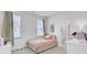 Cozy bedroom with a large window, neutral walls, and an ensuite bathroom at 69 Arrowwood Way, Summerville, SC 29485