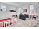 Bright bedroom featuring neutral colors, crib, dresser, and lots of natural light at 69 Arrowwood Way, Summerville, SC 29485