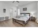 Bright bedroom featuring a rustic wood bed frame, wood floors and ensuite bathroom at 69 Arrowwood Way, Summerville, SC 29485