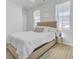 Well-lit bedroom with neutral colors and a king sized bed, two windows with natural light at 69 Arrowwood Way, Summerville, SC 29485