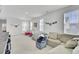 Bright bonus room offering play space and lounge area with a view of the back yard at 69 Arrowwood Way, Summerville, SC 29485