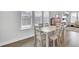 Bright dining room with natural light and hardwood floors at 69 Arrowwood Way, Summerville, SC 29485