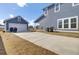 Exterior elevation showing long concrete driveway to garage and the back of the house at 69 Arrowwood Way, Summerville, SC 29485