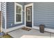 Covered front porch with blue siding and a black front door at 69 Arrowwood Way, Summerville, SC 29485