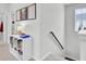Upstairs hallway with built in shelving and pictures on the wall at 69 Arrowwood Way, Summerville, SC 29485